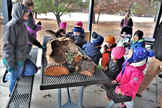 Children participating in the USO Wisconsin’s Hike and Hunt event Nov. 17, 2021, at Fort McCoy, Wis., look at taxidermy mounts that relate to animals of Wisconsin. The items were brought to the event by Natural Resources Specialist Kevin Luepke...