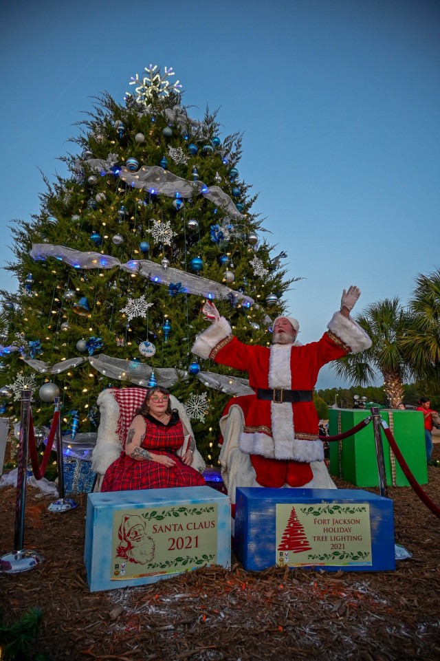 Santa and Mrs. Clause welcome Fort Jackson, SC, children as they arrive to the annual Holiday Tree Lighting Ceremony Dec. 3, 2021, at Patriots Park.