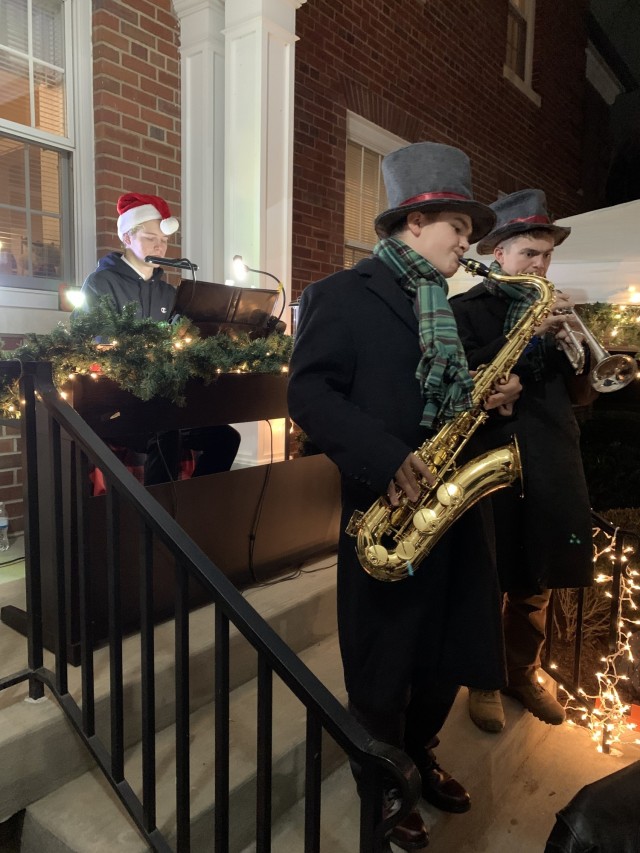 Musicians play holiday tunes for Fort Knox Tour of Homes participants Dec. 9, 2021 on the porch of Quarters 1.