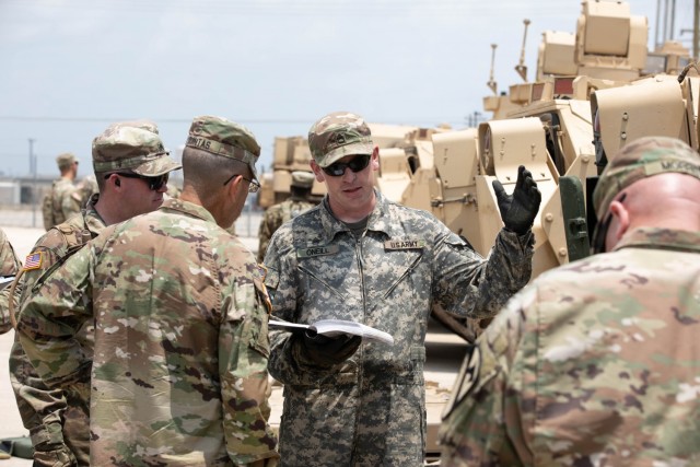 A Soldier from 3rd Armored Brigade Combat Team, 1st Cavalry Division, delivers a briefing to Lt. Gen. Leopoldo Quintas, deputy commanding general, FORSCOM, during a Maintenance Terrain Walk, as part of the unit’s June 21 Ground Readiness Evaluation Assessment and Training Engagement.