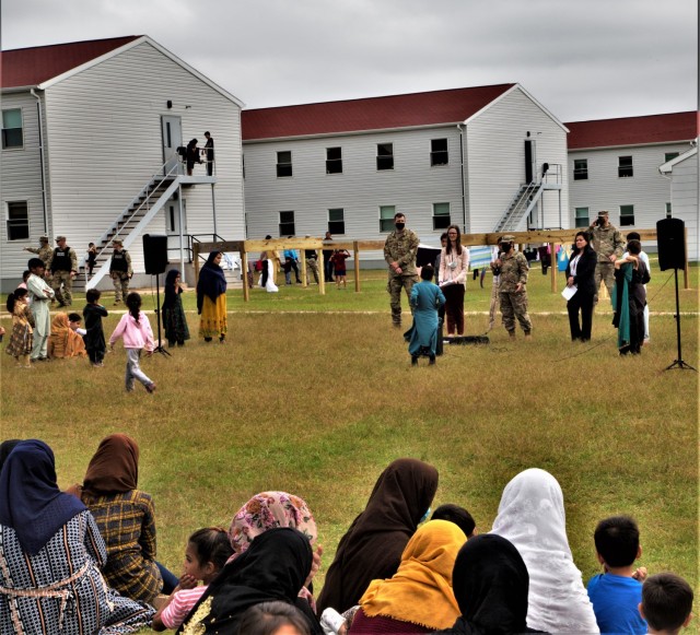 Angela Salazar, center right, the Operation Allies Welcome federal coordinator for Fort McCoy, Department of Homeland Security, holds a town hall in a Fort McCoy barracks area to understand the concerns of Afghan evacuees at Fort McCoy, Wis., on...