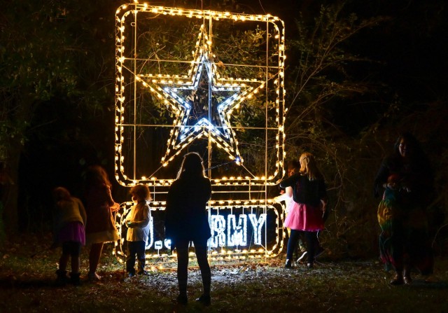 Fort Jackson family members enjoy a stroll through the Liberty Lights Display after attending the Fort Jackson, SC, Holiday Tree Lighting Ceremony on Dec. 3, 2021. The walking trail featured patriotic light displays and Christmas music.