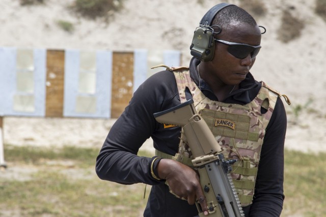A Ranger assigned to the Kenya Defence Forces prepares to engage a target during urban rifle marksmanship training at Manda Bay, Kenya, Oct. 2, 2021. CJTF-HOA, operating from Camp Lemonnier, Djibouti, regularly trains with and works alongside...
