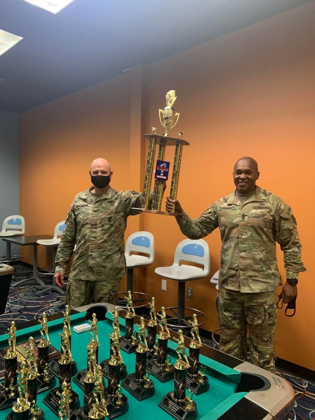 U.S. Army Training Center and Fort Jackson Commanding General Brig. Gen. Patrick R. Michaelis and Post Command Sgt. Maj. Philson Tavernier hoist the 2021 Regional Championship trophy recently won by Fort Jackson's Falcons Pop Warner 8 and under...