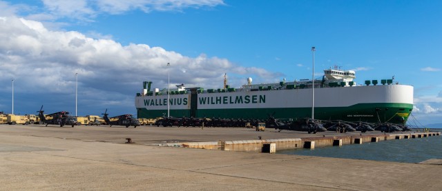 U.S. Army UH-60 Black Hawk helicopters and tactical vehicles belonging to 1st Air Cavalry Brigade (1ACB), 1st Cavalry Division are staged after download from the vessel ARC Independence at the port of Alexandroupoli, Greece, Nov. 30, 2021. The...