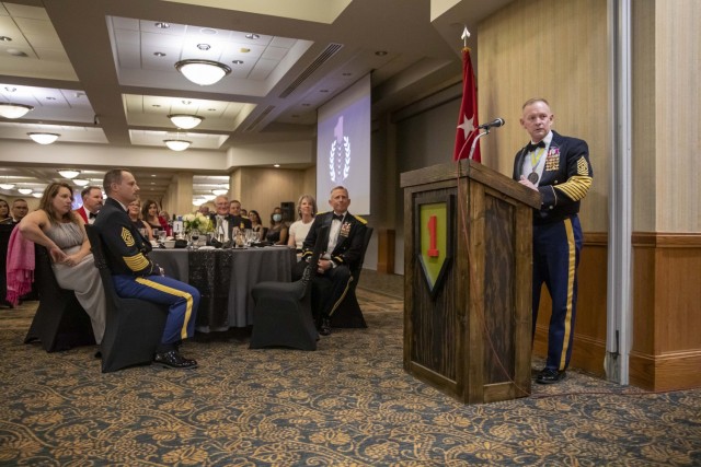 Command Sgt. Maj. Todd Sims, U.S. Army Forces Command and FORSCOM Command Sergeant Major, speaks at the 1st Infantry Division Victory Banquet held on Fort Riley, Kansas, Dec. 10, 2021. Sims spoke about the strength and tenacity of the Big Red One...