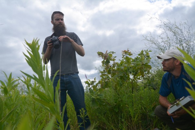 Aaron McFarlane, U.S. Army Corps of Engineers, St. Paul District biologist, and Eric Hanson, U.S. Army Corps of Engineers, St. Paul District ecologist, examine soils in Pool 8 of the Upper Mississippi River, near La Crosse, Wisconsin, July 22, 2020.
