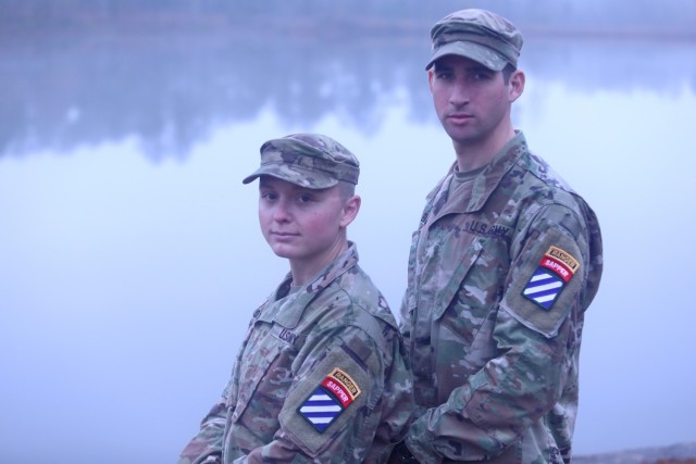 Second Lt. Amanda Atkinson, left, and 1st Lt. Rafael Eirea-Lamberto, right, assigned to the “Gila Battalion,” 9th Brigade Engineer Battalion, 2nd Armored Brigade Combat Team, 3rd Infantry Division, at Fort Stewart, Georgia, pose together with their Ranger and Sapper tabs in front of Victory Pond following their graduation at the U.S. Army Ranger School, Fort Benning, Georgia, Dec. 10, 2021. Atkinson is the first female Soldier in the 3rd ID and fifth in the Army to obtain both the Ranger and Sapper tab – known as "double-tabbed." (U.S. Army photo by Sgt. Trenton Lowery)