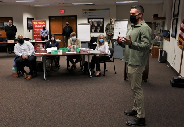 Fort Knox Garrison Commander Col. Lance O’Bryan discusses takeaways with participants from the fall Garrison Leadership Academy Dec. 9, 2021.