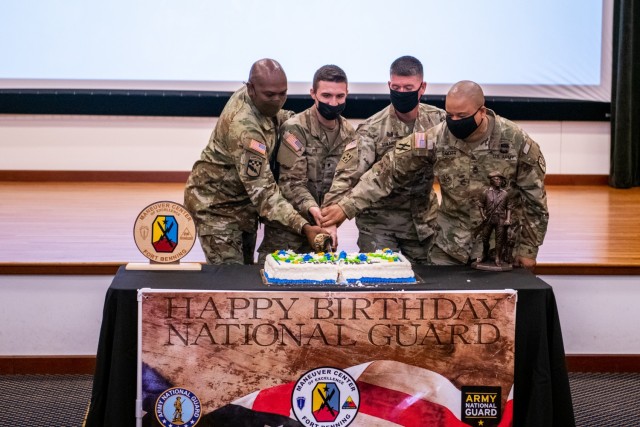 (FORT BENNING, Ga) – Maj. Gen. Patrick J. Donahoe, commanding general, Maneuver Center of Excellence and Fort Benning, and Command Sgt. Maj. Derrick C. Garner, command sergeant major, MCoE and Fort Benning, joined the local senior and junior National Guard members to hoist the ceremonial sabre, cutting the cake and marking the National Guard’s 385th birthday during a ceremony held Dec. 13. (U.S. Army photos by Patrick A. Albright, Fort Benning Maneuver Center of Excellence Public Affairs)