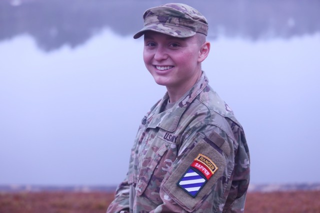 Second Lt. Amanda Atkinson, assigned to the “Gila Battalion,” 9th Brigade Engineer Battalion, 2nd Armored Brigade Combat Team, 3rd Infantry Division, at Fort Stewart, Georgia, poses with her Ranger and Sapper tabs in front of Victory Pond following her graduation at the U.S. Army Ranger School, Fort Benning, Georgia, Dec. 10, 2021. Atkinson is the first female Soldier in the 3rd ID and fifth in the Army to obtain both the Ranger and Sapper tab – known as "double-tabbed." (U.S. Army photo by Sgt. Trenton Lowery)