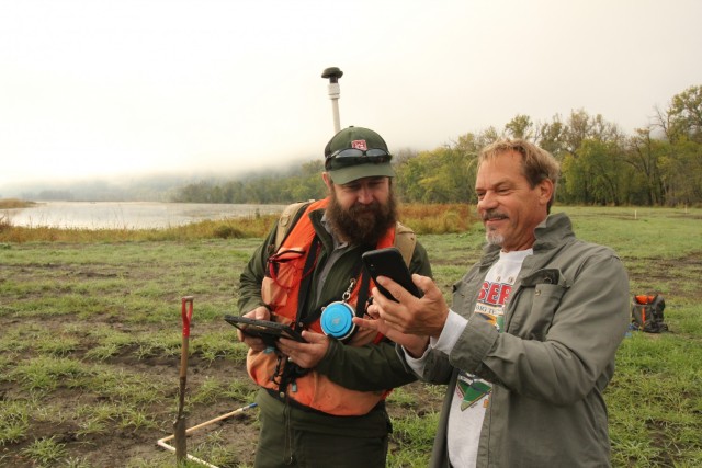 Andy Meier, U.S. Army Corps of Engineers, St. Paul District forester, and Dr. Chuck Theiling, Engineer and Research Development Center aquatic research ecologist, examine soil data at the Conway Lake restoration project upstream of Lansing, Iowa,...