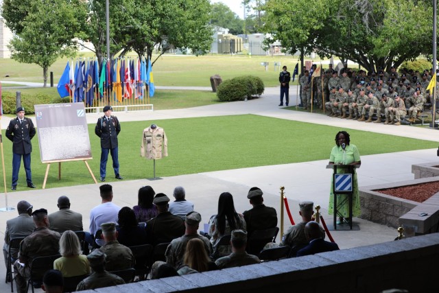 Kasinal Cashe White, the sister of Sgt. 1st Class Alwyn C. Cashe, delivers a speech during the Cashe Garden dedication ceremony on Fort Stewart, Georgia, May 20th, 2021. During Marne Week, the Division dedicated the Sgt. 1st Class Alwyn C. Cashe Garden to honor the Dogface Soldier, leader and Silver Star Medal recipient, and to inspire others to emulate his example.(U.S. Army photo by Staff Sgt. Prosper Ndow)