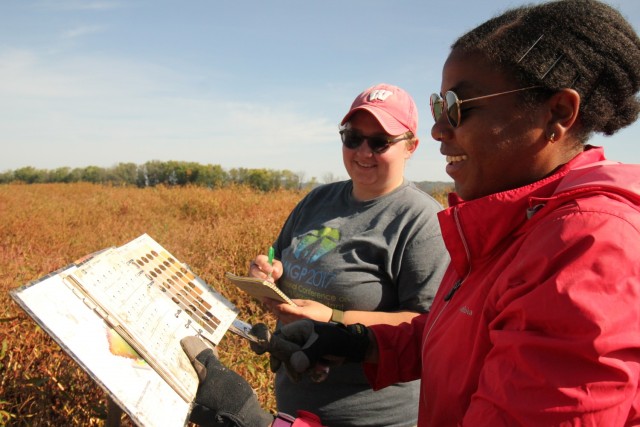 Marissa Kneer and Nia Hurst, Engineer and Research Development Center research biologists, consult a Munsell chart to characterize soils, at the U.S. Army Corps of Engineers, St. Paul District Conway Lake restoration project upstream of Lansing,...