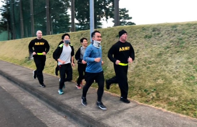 U.S. Army and Japan Ground Self-Defense Force dental personnel go for an early-morning run during joint training at Camp Zama, Japan. American and Japanese dental teams got together in November for two days of joint training, sharing techniques and experiences, and building teamwork.