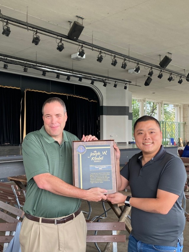 John Carrell, U.S. Army Corps of Engineers, St. Paul District, district counsel, presents Vinai Vinlander, U.S. Army Corps of Engineers, St. Paul District, deputy district counsel, the Joseph W. Kimbel award.