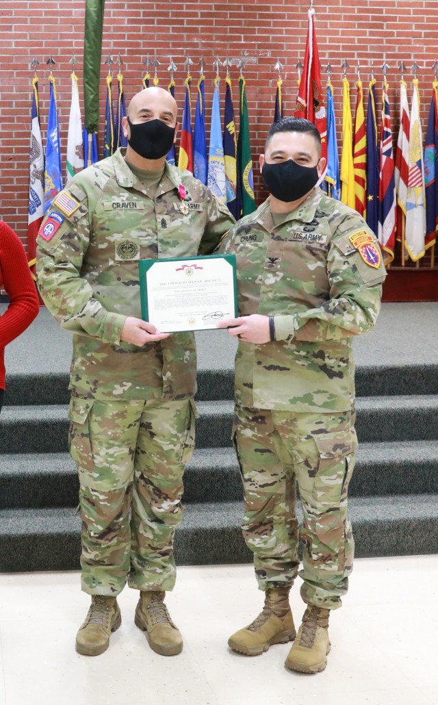 Command Sgt. Maj. Robert  T. Craven, brigade command sergeant major, 5th Secuirty Force Assistance Brigade, receives The Legion of Merrit award from Col. Jonathan Chung, brigade commander, 5th SFAB in recognition for his exceptionally meritorious service his Change of Responsibility ceremony, 13 Dec. 2021, Joint Base Lewis McChord, WA.