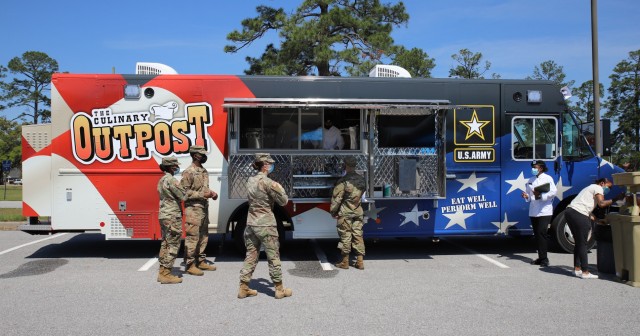 Fort Stewart, Georgia - Soldiers from 3rd Support Brigade, 3rd Infantry Division, order their lunch from a food truck parked in their brigade area, Fort Stewart, Georgia, April 13. In 2017, Fort Stewart became one of the first bases to utilize...