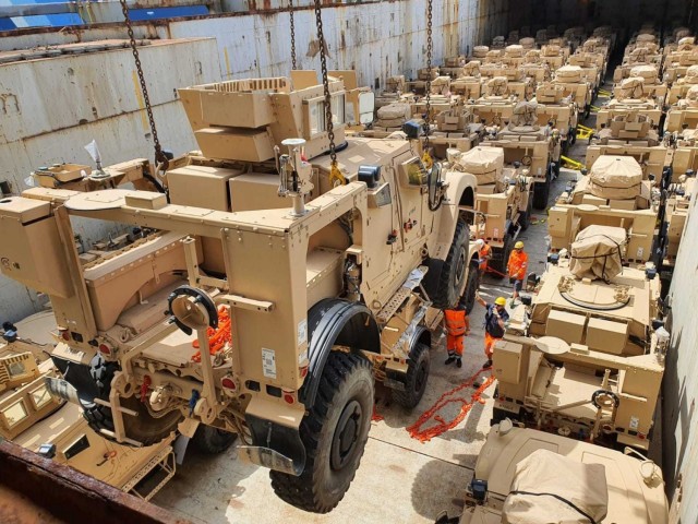 A Mine Resistant Ambush Protected All Terrain Vehicle, or M-ATV, is lowered into the hull of the Ocean Giant cargo vessel at the Port of Livorno in Italy. The 405th Army Field Support Brigade’s Army Field Support Battalion-Africa was responsible...