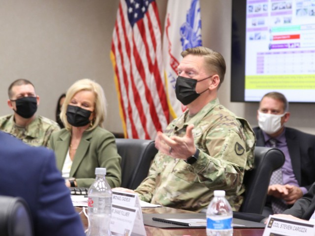 Maj. Gen. Darren Werner (2nd from right), commanding general U.S. Army Tank-automotive and Armaments Command, talks with Lt. Governor Garlin Gilchrist, Michigan, about the TACOM mission at the Detroit Arsenal Dec. 6.  Tammy Carnrike (2nd from...