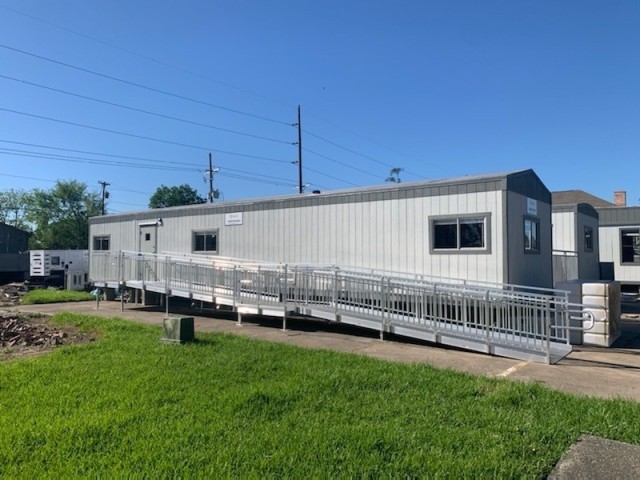 These trailers were set up at a vaccine trial location in Lake Charles, Louisiana.  The ramps were installed to assure compliance with the Americans with Disabilities Act.  This photo was taken before Hurricane Delta struck the Lake Charles area;...