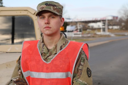 Zach Neisz, with the 130th Engineer Support Battalion, Kentucky National Guard takes a moment to pose for a photo while he was working to control traffic flow in and out of Dawson Springs, Ky., one of the hardest-hit areas by the tornadoes that hit late on Dec. 10, 2021. Neisz who lives in Dawson Springs spent the first 27 hours after the storm aiding local law enforcement, helping extract people from their homes. 