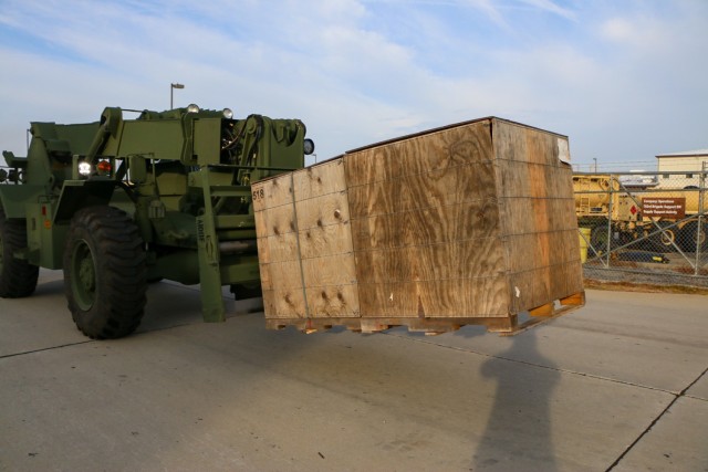 Soldiers assigned to the brigade support operations office in the "Maintain Battalion," 703rd Brigade Support Battalion, 2nd Armored Brigade Combat Team, 3rd Infantry Division, move excess material with a forklift from the 9th Brigade Engineer Battalion motor pool at Fort Stewart, Georgia, Dec. 6, 2021. This consolidated divestiture of excess materiel was completed in preparation of the brigade executing the Regionally Aligned Readiness and Modernization Model. (U.S. Army photo by Sgt. Trenton Lowery)
