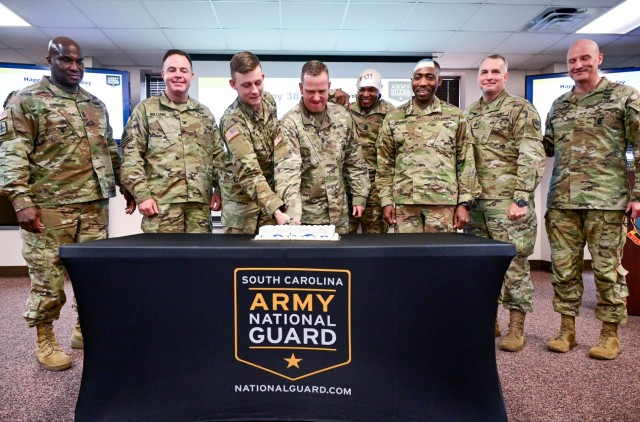 Leadership from the South Carolina National Guard and Fort Jackson cut a cake celebrating the National Guard’s 385th Birthday Dec. 13, 2021. Brig. Gen. David M. Jenkins, Assistant Adjutant General of the South Carolina National Guard, was the guest speaker for the celebration. Fort Jackson Commanding General Brig. Gen. Patrick R. Michaelis joined South Carolina National Guard Soldiers serving on the installation to wish the guard a happy birthday.