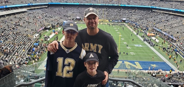 Joseph Kidwell Jr. with sons Andre (left) and Aaron (right) during the 122nd Army-Navy Game.