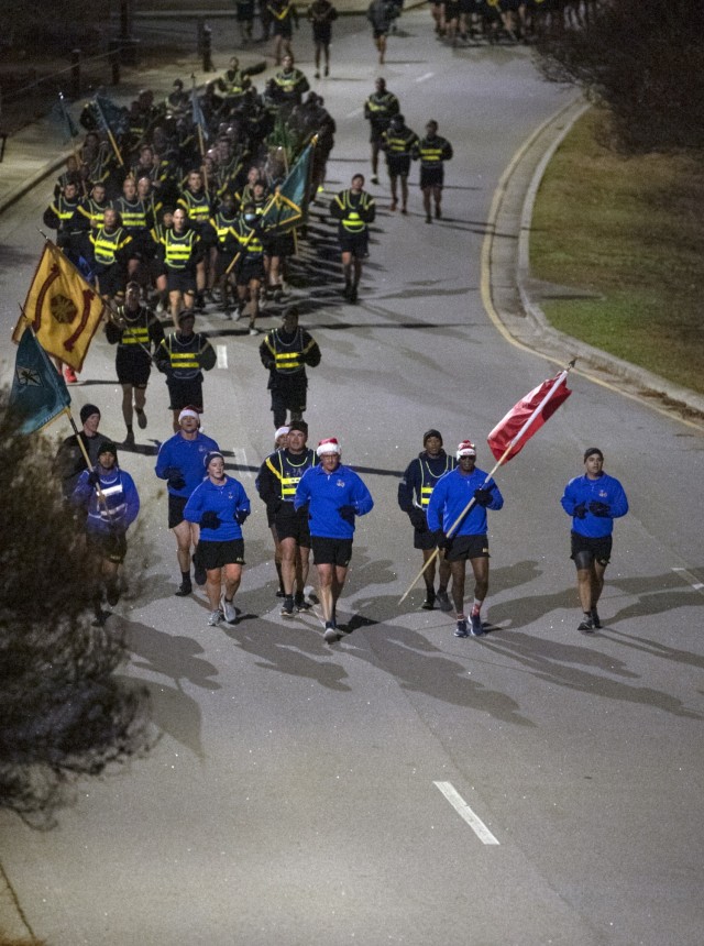 Fort Jackson Commanding General, Brig. Gen. Patrick R. Michaelis, leads post units in a Holiday Run Dec. 14.