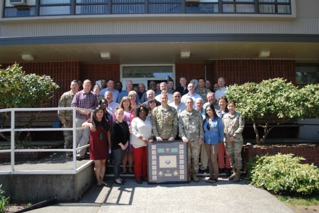 Col. Peter Crandall, previous 404th Army Field Support commander, gathers for a photo with 404th AFSB personnel at Joint Base Lewis McChord, Washington, prior to his departure from the brigade in June 2019. (Photo by George Cox, 404th AFSB)