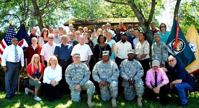 The 404th Army Field Support Brigade leadership and staff gather for a group photo on June 4, 2013, at Joint Base Lewis McChord, Washington. (Photo courtesy of U.S. Army)