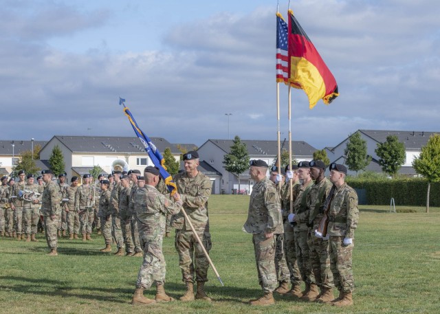 Gen. Christopher Cavoli, Commanding General of U.S. Army Europe and Africa passes the unit &#34;colors&#34; to Col. Jonathan Byrom, Commander of 2nd Multi-Domain Task Force during the 2nd MDTF activation ceremony on Clay Kaserne in Wiesbaden, Germany, Sept. 16, 2021.