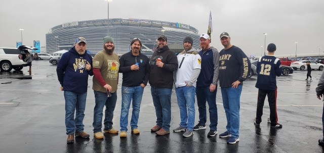 Members of the USASAC family tailgate before heading in to watch the 122nd Army-Navy game.