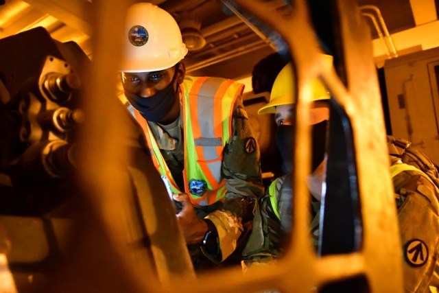 Sgt. Jonathen Reuben (left) and Sgt. Dylan Labbie, verify piece count on the USNS Mendonca in support of phase II of a sea emergency deployment readiness exercise August 23, 2021 at Naval Weapons Station, Joint Base Charleston, South Carolina. The two Soldiers are Deployment Support Command cargo specialists augmenting the 841st Transportation Battalion. 