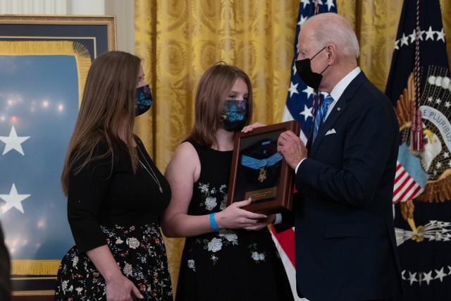 President Joe Biden presents the Medal of Honor to Katherine Celiz, [left] widow of Sgt. 1st Class Christopher Celiz, and their daughter, Shannon, during a ceremony at the White House on Dec. 16, 2021. Celiz was posthumously awarded the Medal of Honor for actions of valor during Operation Freedom’s Sentinel while serving as a battalion mortar platoon sergeant with Company D, 1st Battalion, 75th Ranger Regiment, in Paktiya province, Afghanistan, on July 12, 2018.  (U.S. Army photo by Laura Buchta)