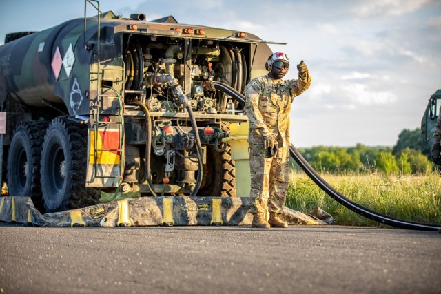 U.S. Army Sgt. Nicholas Bostic, a 92F (petroleum supply specialists), is on FARP (Forward Arming and Refueling Point) operations for the 1-3rd Attack Battalion during the landing of two UH-72 Lakota helicopters assigned to the 7th Army Training Command, at Tazar, Hungary, during Exercise Saber Guardian in support of DEFFENDER-Europe 21.