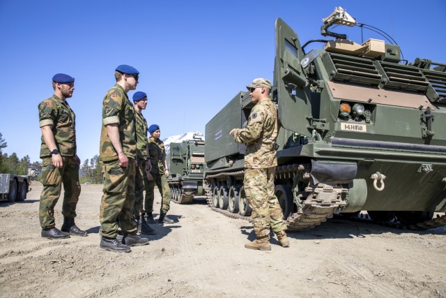 U.S. Army Soldiers assigned to 1st Battalion, 6th Field Artillery, teach Norwegian soldiers about their MLRS, how they operate and the other equipment they use during Operation Thunderbolt at Setermoen, Norway, June 4, 2021. Operation Thunderbolt is an exercise that’s part of a larger series of exercises called Fires Shock. Fires Shock demonstrates the rapid deployment of long-ranged precision fires and joint forcible entry fires across two continents from the Baltics to the Black Sea and from the Arctic to North Africa. 