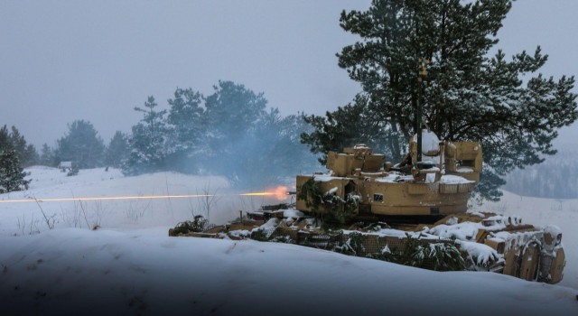 U.S. Army Soldiers with 3rd Battalion, 66th Armored Regiment, 1st Armored Brigade Combat Team, 1st Infantry Division, fire 25mm rounds using an M2A3 Bradley Fighting Vehicle during a multi-company live-fire exercise at Camp Ādaži, Ādaži, Latvia, Dec 3, 2021. Soldiers with 3-66 are currently participating in Winter Shield 2021, a combined forces exercise that strengthens ties between NATO allies and partner nations through integrated training exercises. 