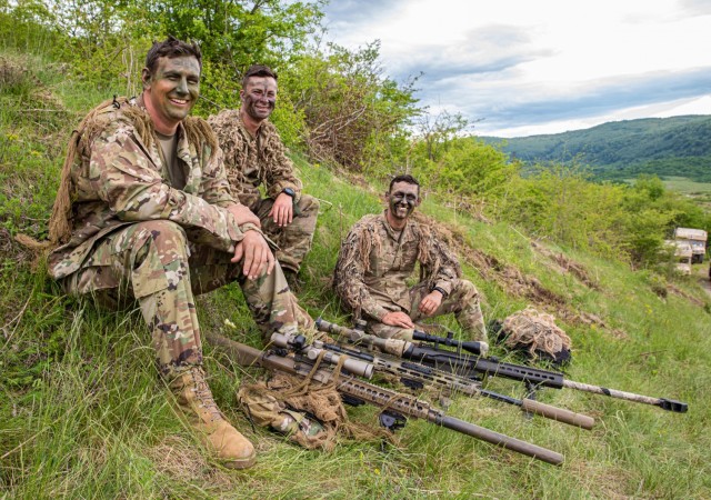 Sgt. Dustin Potter (from left), Spc. Dylan Prather and Spc. Timothy Beckman, U.S. Army Soldiers assigned to 2nd Battalion, 124th Infantry Regiment, pause on a hillside for a photo while overlooking Manjača Training Area after a joint exercise in Bosnia and Herzegovina, May 22, 2021. Members of the 2-124th and Armed Forces of Bosnia and Herzegovina trained together in support of Immediate Response 21. This effort supports DEFENDER-Europe 21, a multinational joint exercise that demonstrates and develops the extensive military capabilities that NATO allies and partners have to prevent conflict, preserve peace and keep our nations safe. 
