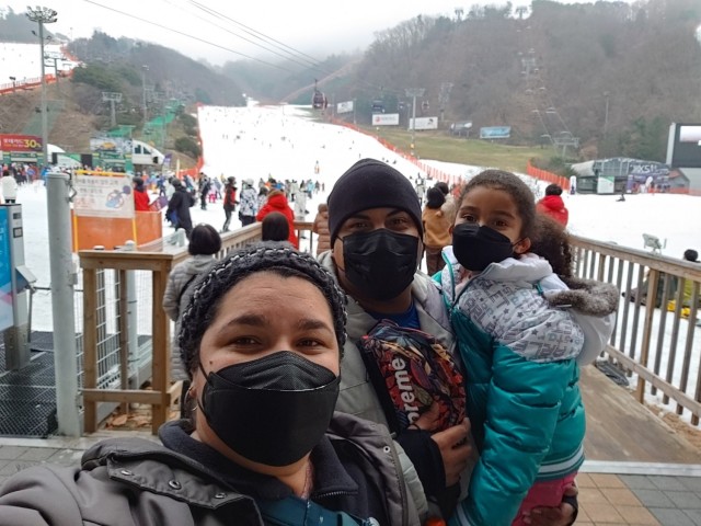 The Shaw family, from U.S. Army Garrison Humphreys, prepares to play in the snow at a Strong Bonds marriage training event Dec. 11, 2021 at Vivaldi Ski Resort in Hongcheon City, South Korea.