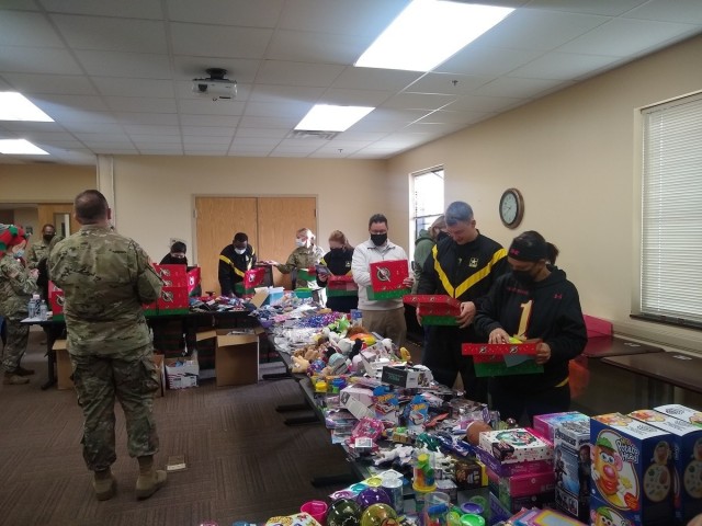 Members of the Fort Riley Soldier Recovery Unit (SRU) in Kansas help fill boxes of toys that will be sent to children in Mexico. (Photos courtesy of Rebecca Weston)