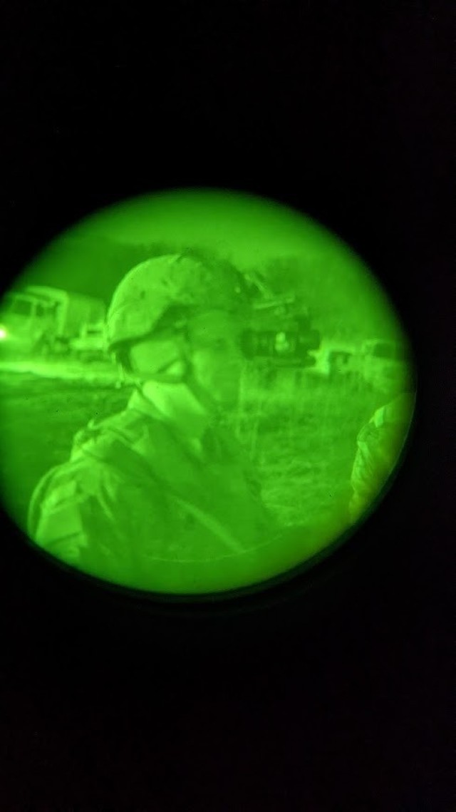 Staff Sgt. Andrew Mangnall tests night vision goggles (NVGs) prior to conducting nighttime drivers training at Oberdachstetten Training Area, Germany, Dec. 16, 2021. (U.S. Army photo by Capt. Taylor Criswell)