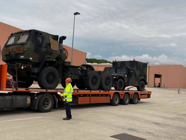 Another line haul truck arrives at Leghorn Army Depot, Italy, carrying Army Prepositioned Stock-2 vehicles shipped from a 405th Army Field Support Brigade APS-2 worksite north of the Alps to Army Field Support Battalion Africa’s APS-2 worksite...