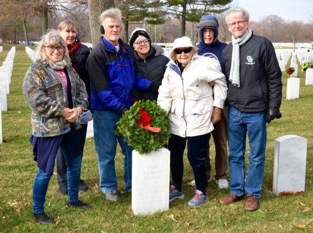 Marilynn Palmquist Stone, age 97, is surrounded by her family as she marks the grave of her husband, John Robert Stone, who served in the Army Air Corps during World War II.