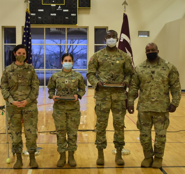 Col. Caryn Vernon and Command Sgt. Maj. Johnnathan Quaye present Spc. Lourdes Moreno and Sgt. 1st Class Demetrius Roberson as the Solider and NCO of the Year for Fort Knox MEDDAC, Fiscal Year 2021.