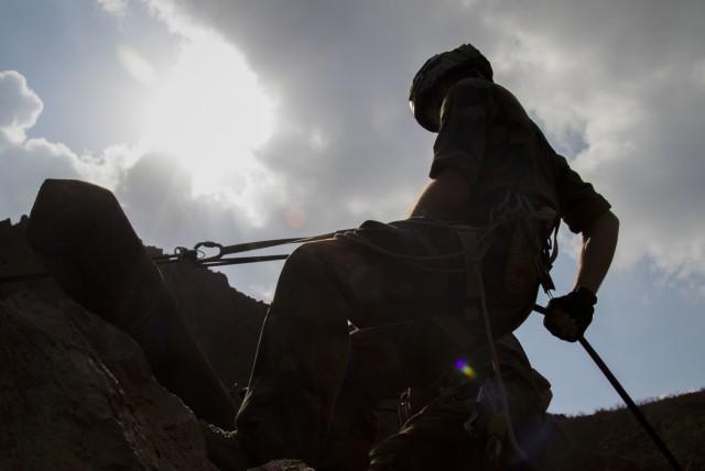 A French service member with the 5th Overseas Interarms Regiment (5e RIAOM) rappells approximately 200 feet down a mountain at the Arta Range Complex, Djibouti, Dec. 15, 2021. Five instructors from the U.S. Army Mountain Warfare School in Jericho, Vt. taught a five-day Joint Expeditionary Mountain Warfare Course on basic military mountaineering skills to French service members in Djibouti to strengthen the relationships among the international forces working together in the region.

(U.S. Army Photo by Staff Sgt. Amanda Stock)