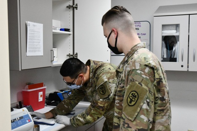 The work of Pfc. Zachary Jones and Pfc. Jonathan Martinez was put under the microscope during the accreditation process. Their work representing the YPG laboratory passed the College of American Pathologists inspections with a score of 99%...