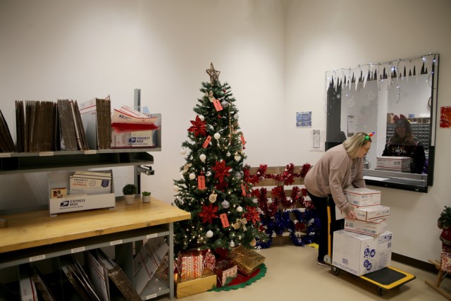 USAG Benelux postal workers at Chièvres Air Base, Belgium process holiday mail Dec. 17, 2021. (U.S. Army photo by Libby Weiler, USAG Benelux Public Affairs)