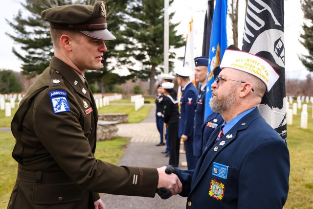 Lieutenant Colonel Colestock shakes hands with Paul Martin the representative from the VFW